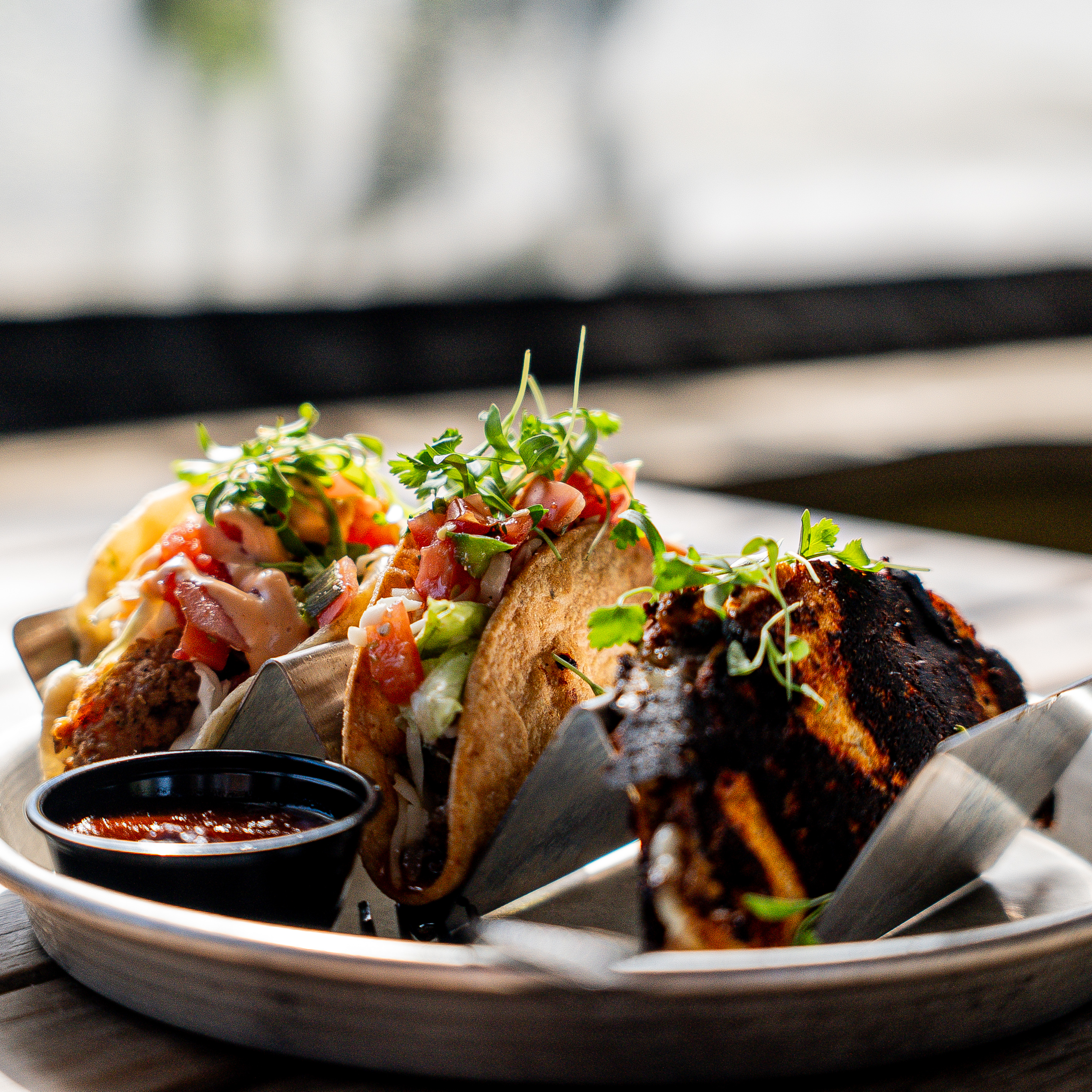 Gourmet tacos with fresh garnish — food photography
